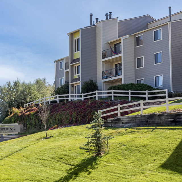 Whispering Hills - Exterior View with Green Landscape